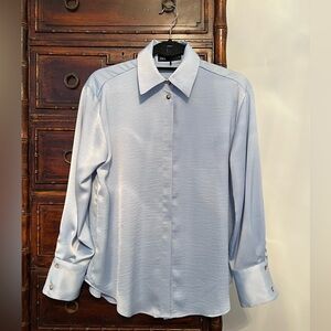 Zara satin effect polyester light blue shirt with hidden buttons.